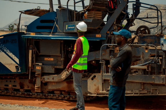 Infrastructure construction with heavy machinery and workers